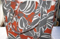 Gray and orange floral purse